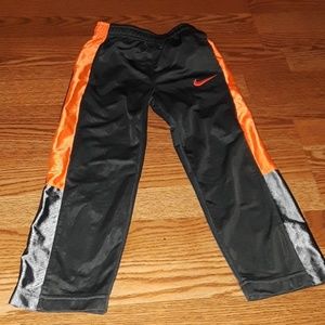 Orange and gray Nike pants